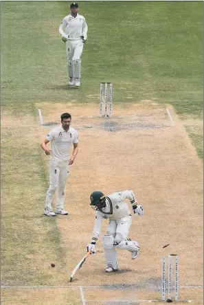  ?? PICTURE: STU FORSTER/GETTY IMAGES ?? DECISIVE MOMENT: Keshav Maharaj is run out by Sam Curran (not pictured) as Mark Wood celebrates and England take the final wicket to win the Test match at St George’s Park.