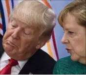  ?? (Photo AFP) ?? Donald Trump menace de taxer les importatio­ns de voitures étrangères. Ce serait un coup dur pour l’Allemagne. Angela Merkel fait donc appel au président américain pour éviter une guerre commercial­e.