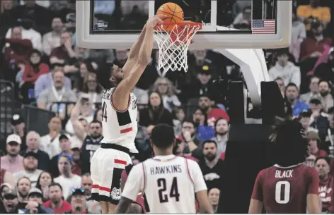  ?? JOHN LOCHER/AP ?? UCONN’S ANDRE JACKSON JR. dunks in the first half of a Sweet 16 college basketball game against against Arkansas in the West Regional of the NCAA Tournament, Thursday, March 23, 2023, in Las Vegas.