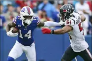  ?? JOSHUA BESSEX - THE ASSOCIATED PRESS ?? Buffalo Bills wide receiver Stefon Diggs (14) stiff arms Houston Texans outside linebacker Kamu Grugier-Hill (51) during the second half of an NFL football game, Sunday, Oct. 3, 2021, in Orchard Park, N.Y.