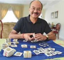  ?? Pictures: Pankaj Sharma/Gulf News ?? Mitresh Singh with his collection of coins at his residence in Meadows, Dubai. He now has around 2,000 coins.