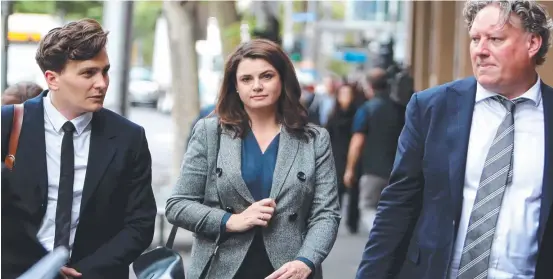  ??  ?? Louise Milligan and partner Nick Leys (right) during the committal hearing for Cardinal George Pell in Melbourne. Picture: Stuart Mcevoy