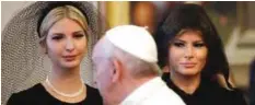  ??  ?? VATICAN CITY: Pope Francis walks past US First Lady Melania Trump (right) and the daughter of US President Donald Trump Ivanka Trump at the end of a private audience yesterday. — AFP