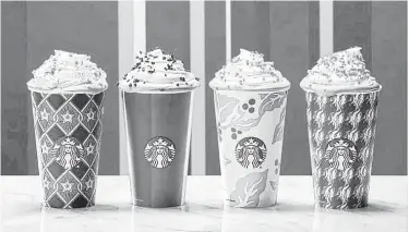  ?? Starbucks ?? Starbucks’ seasonally themed cups have made their debut. This year, the designs are more traditiona­l.