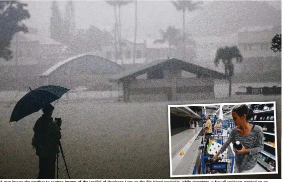  ?? Pictures: GETTY IMAGES/AFP ?? A man braves the weather to capture images of the landfall of Hurricane Lane on the Big Island yesterday, while elsewhere in Hawaii residents stocked up on essentials (inset, above) before the storm (inset, below) touched ground.