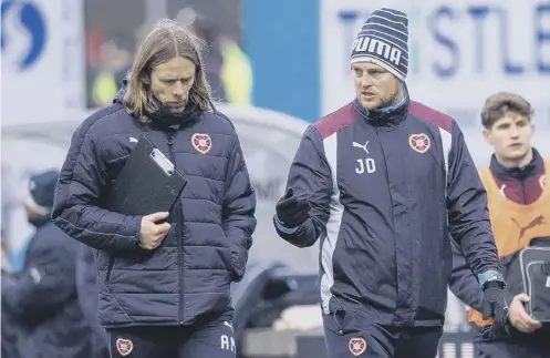  ??  ?? 0 Austin Macphee, left, will assist Jon Daly when the Hearts under-20 coach takes charge of the first team against Celtic on Saturday.