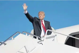  ?? EVAN VUCCI/AP ?? ON THE ROAD: President Trump boards Air Force One to fly to a campaign rally in Ohio.