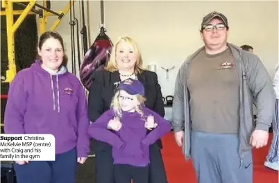  ??  ?? Support Christina Mckelvie MSP (centre) with Craig and his family in the gym