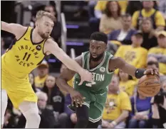  ?? AP photo ?? The Celtics’ Jaylen Brown is fouled by the Pacers’ Domantas Sabonis during the second half of Boston’s 104-96 win over Indiana on Friday.