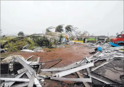  ?? The Associated Press ?? Damaged structures and uprooted trees lie Friday in Puri district after Cyclone Fani hit the coastal eastern state of Odisha, India.