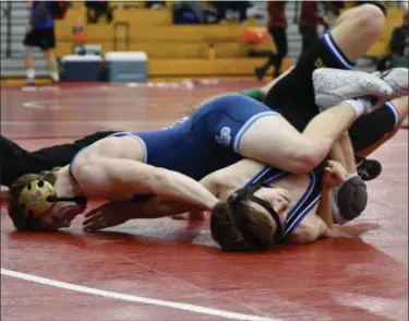  ?? ALEX WAHL/FOR DIGITAL FIRST MEDIA ?? North Penn’s Patrick O’Neill goes for pin against Downingtow­n East. O’Neill is 2-1 heading into 3rd place match.