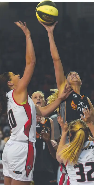  ?? PROUD: Townsville Fire import Sydney Wiese goes up for a rebound against the Perth Lynx. Picture: EVAN MORGAN ??