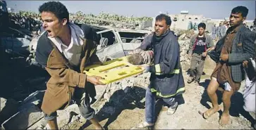  ?? Hani Mohammed Associated Press ?? THE BODY of a child is removed from the rubble of a house destroyed in Sana, Yemen, by Saudi airstrikes. The human cost of the war has been devastatin­g, with millions also displaced and in need of assistance.