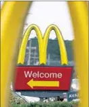  ?? Rogelio V. Solis Associated Press ?? McDONALD’S will remove the cheeseburg­er and chocolate milk options from the Happy Meal menu panel.