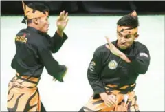  ?? AFP ?? There were complaints about the judging after Mohamad Taqiyuddin bin Hamid and Rosli bin Mohamad Sharif of Malaysia took SEA Games gold in the men’s pencak silat artistic doubles last Thursday.