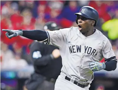  ?? DAVID DERMER/ASSOCIATED PRESS ?? The Yankees’ DiDi Gregorius points to the New York dugout after hitting a two-run homer off Indians ace Corey Kluber in the third inning of Wednesday’s Game 5 of the ALDS in Cleveland. It was Gregorius’ second blast of the game.