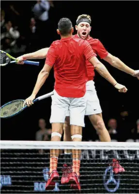  ??  ?? Jack Sock and Nick Kyrgios of Team World celebratin­g their win over Team World’s Rafael Nadal-Tomas Berdych on the opening day of the Laver Cup on Friday. — Reuters Chest bumpers: