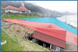  ?? Pictures: GLEN MINIKIN ?? The front of the huts has been left leaning at a crazy angle after netting was put in place, above, to protect passers-by from flying debris. Below, the terrace shortly after it was completed in 1911