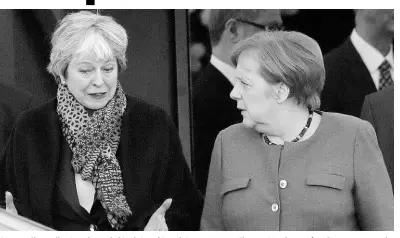  ?? AP ?? German Chancellor Angela Merkel (right) and British Prime Minister Theresa May leave after their meeting at the chanceller­y in Berlin, Germany, Tuesday, April 9, 2019.