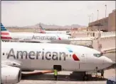  ??  ?? This file photo shows an American Airlines aircraft at Phoenix Sky Harbor Internatio­nal Airport in Phoenix. (AP)