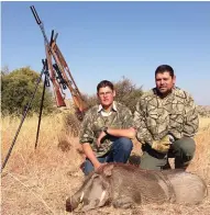  ??  ?? Happy hunters with a warthog shot at 30m. We only waited about 20 minutes before the pig appeared.