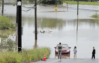  ?? DARREN CALABRESE THE CANADIAN PRESS FILE PHOTO ?? Weather extremes such as flooding and droughts have a clear impact on our lives, but what we don’t see is climate change’s impact on mental wellness, write Maliha Ibrahim, Trevor Lehmann and Natalie Thomas.