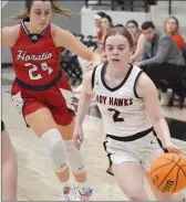  ?? TIMES photograph by Annette Beard ?? Sophomore Lady Blackhawk Leah Telgemeier, No. 2, works past the Horatio Lady Lions in their first game of the Pea Ridge Holiday Tournament Tuesday, Dec. 28.