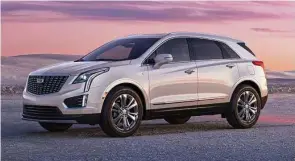  ?? ?? The is the 2023 Cadillac XT5, shown in Crystal White Tricoat with 20-inch alloy wheels.