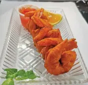  ?? Photo: Charles Chambers ?? Prawns koliwada at Habibi restaurant.