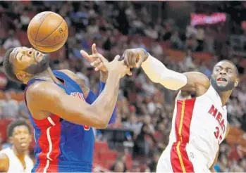  ?? JOE SKIPPER/AP ?? The Heat’s Willie Reed, right, knocks the ball away from Detroit center Andre Drummond in their game Sunday.