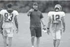  ?? JOSEPH MAIORANA/USA TODAY SPORTS ?? Brian Callahan, center, is the Bengals’ offensive coordinato­r. In 2021, the team is averaging 27.3 points per game.