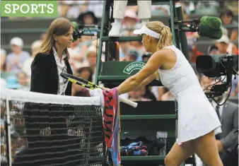  ?? Ben Curtis / Associated Press ?? Caroline Wozniacki of Denmark talks to the referee during her match against Ekaterina Makarova of Russia. Wozniacki, the second seed, staved off five match points, but still lost.