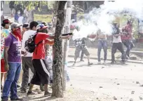  ?? Agence France-presse ?? Students clash with riot police close to Nicaragua’s Technical College during protests against government’s reforms in the Institute of Social Security in Managua on Saturday.