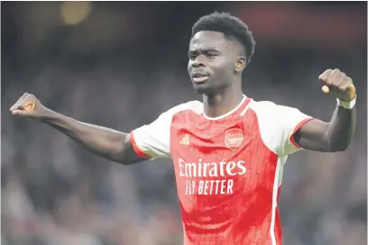  ?? Picture: Getty Images ?? CHUFFED. Arsenal’s Bukayo Saka celebrates after scoring a goal during their English Premier League match against Liverpool at the Emirates last night.