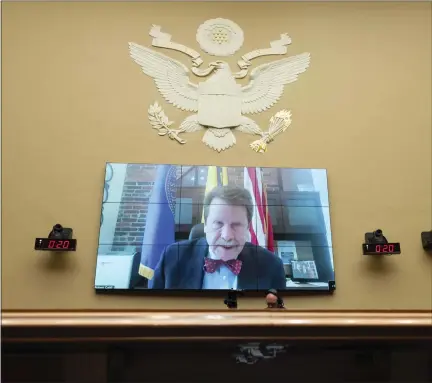  ?? KEVIN WOLF — THE ASSOCIATED PRESS FILE ?? Food and Drug Administra­tion Commission­er Robert Califf testifies via video during a House Commerce Oversight and Investigat­ions subcommitt­ee hybrid hearing on the nationwide baby formula shortage May 25, 2022, in Washington. Califf has spent much of his last year on the job warning that growing “distortion­s and half-truths” surroundin­g vaccines and other medical products are a major driver of sickness and death in America.