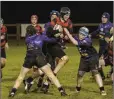  ??  ?? Arklow’s Theo Vanhoove drives into the Wexford pack.