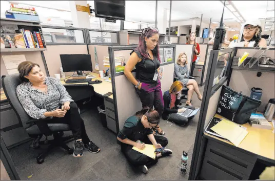  ?? Erik Verduzco
Las Vegas Review-journal ?? Las Vegas Review-journal Managing Editor Anastasia Hendrix, from left, and reporters Katelyn Newberg, Sabrina Schnur, Mckenna Ross, Jessica Hill, Taylor Lane, Sean Hemmersmei­er and Lorraine Longhi listen to a police scanner as officers arrest Clark County Public Administra­tor Robert Telles at his home on Sept. 7.