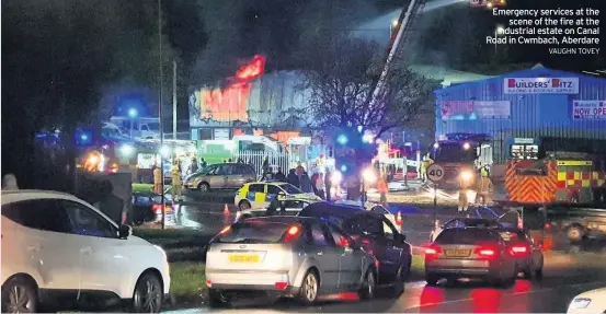  ?? VAUGHN TOVEY ?? Emergency services at the scene of the fire at the industrial estate on Canal Road in Cwmbach, Aberdare