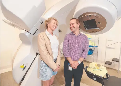  ?? Picture: RICHARD GOSLING ?? Philippa Douglas and Dr Jim Jackson, with the Varian HyperArc machine at the Gold Coast Private Hospital.