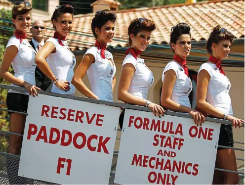  ?? GETTY IMAGES ?? Page stopper: Formula One has scrapped the long-standing practice of grid girls like these before races