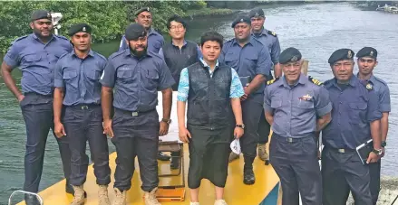  ?? Photo: Arieta Vakasukawa­qa ?? Fiji Navy officers with Korean Hydrograph­ic and Oceanograp­hic Agency official, Jungung Kim (middle) at Pacific Harbour on July 17, 2017.