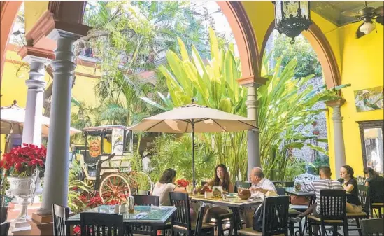  ?? Photograph­s by Margo Pfeiff ?? LA CHAYA MAYA serves traditiona­l Yucatecan cuisine set in an old colonial manor with a courtyard near Parque de Santa Lucia in Mérida. Try its papadezule­s.