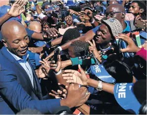  ?? Picture: Simphiwe Nkwali ?? DA leader Mmusi Maimane greets his supporters during the party’s final rally, in Dobsonvill­e Stadium. An internal fight for the party’s soul is seen as having cost it votes.