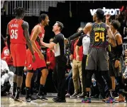  ?? AP ?? Trail Blazers forward Trevor Ariza had to be held back from Trae Young during Saturday’s game in Atlanta, after which he lamented Young’s “funnies” — a dribble move the young Hawks star attempted against the veteran.