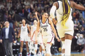  ?? Brian A. Pounds / Hearst Connecticu­t Media ?? UConn’s Azzi Fudd smiles following a made basket during her team’s 75-58 win over Indiana in their Sweet 16 game Saturday in Bridgeport.