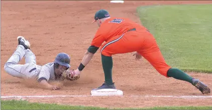  ?? STEVEN MAH/SOUTHWEST BOOSTER ?? Swift Current 57’s third baseman Bo Mcclintock (right) was waiting with the tag for Weyburn’s Luke Lubinieki on a stolen base attempt during the season opener on Friday.