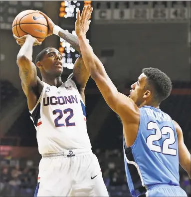  ?? Jessica Hill / Associated Press ?? UConn’s Terry Larrier looks to shoot as Columbia’s Nate Hickman defends in the first half of Wednesday night’s game in Storrs.