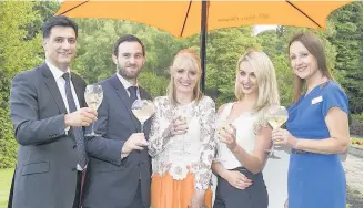  ??  ?? ●● Michael Lavizani, general manager, Mark Spanton, operations manager, Alison Gleave, venue dresser, Netty Hickling, sales executive, and Emma Murray, director of sales at the opening of Mottram Hall’s new Champagne bar