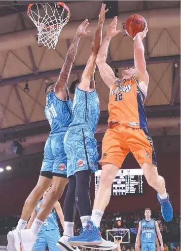  ?? Picture: GETTY ?? BIG EFFORT: Lucas Walker of the Snakes goes to the basket during the round nine NBL match between the Cairns Taipans and the New Zealand Breakers at Cairns Convention Centre.