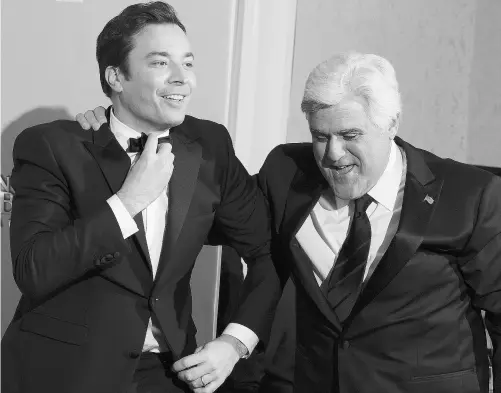 ?? ROBYN BECK/AFP/ GETTY IMAGES ?? The Tonight Show’s Jay Leno yuks it up with his successor-in-waiting, Late Night host Jimmy Fallon. Women and minorities have conquered traditiona­lly white male-dominated arenas, on and off TV, but have been nearly invisible on late-night talk shows.
